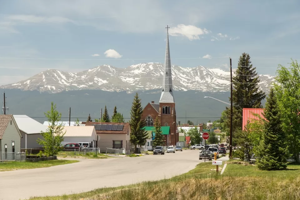 Church with tall steeple in rural Colorado.